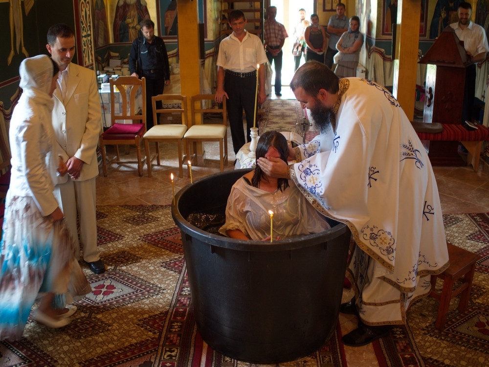 orthodox christian being baptized