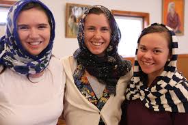 smiling women in headscarves