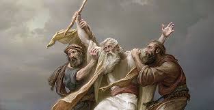 Moses with his arm outstretched, with help