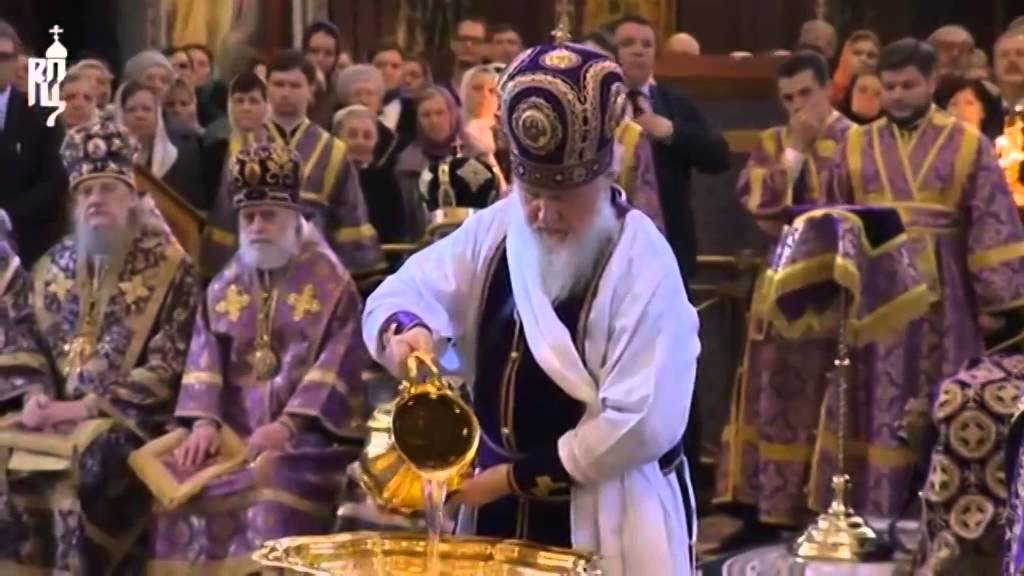 clergy preparing water for foot washing