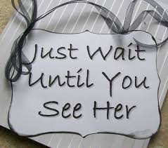 sign with text: Just wait until you see her